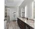 Luxurious bathroom featuring a glass-enclosed shower and double sink vanity at 4200 W 17Th Ave # 912, Denver, CO 80204