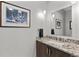 Elegant bathroom vanity featuring granite countertops, modern fixtures and a decorative mirror at 4200 W 17Th Ave # 912, Denver, CO 80204