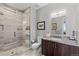 Modern bathroom featuring a glass-enclosed shower and a granite-topped vanity at 4200 W 17Th Ave # 912, Denver, CO 80204