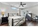 Bright bedroom with hardwood floors, a ceiling fan, and natural light at 4200 W 17Th Ave # 912, Denver, CO 80204