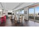 Elegant dining area with city views, modern chandelier, and comfortable seating at 4200 W 17Th Ave # 912, Denver, CO 80204