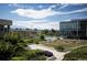 Stunning exterior view showcasing lush landscaping, pool, and contemporary building design at 4200 W 17Th Ave # 912, Denver, CO 80204