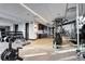 Modern gym featuring free weights, weight machines, and plenty of workout space at 4200 W 17Th Ave # 912, Denver, CO 80204