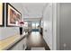 Hallway leading to a dining room featuring an open floor plan and hardwood floors at 4200 W 17Th Ave # 912, Denver, CO 80204