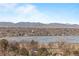 Magnificent scenery overlooking the lake with mountains in the background and green trees in the foreground at 4200 W 17Th Ave # 912, Denver, CO 80204