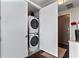 Convenient laundry area with a stacked washer and dryer unit at 4200 W 17Th Ave # 912, Denver, CO 80204
