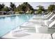 Relaxing poolside scene with lounge chairs and towels offering a comfortable and luxurious experience at 4200 W 17Th Ave # 912, Denver, CO 80204
