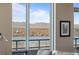 Breathtaking view of city and lake from a large window at 4200 W 17Th Ave # 912, Denver, CO 80204