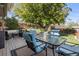 Spacious backyard featuring a wood deck with dining furniture and a beautifully landscaped lawn at 760 Deframe St, Golden, CO 80401
