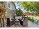 Inviting backyard featuring a wood deck with stylish outdoor seating and a beautifully landscaped lawn at 760 Deframe St, Golden, CO 80401