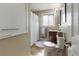 Well-lit bathroom featuring a modern vanity, updated fixtures, and shower with white curtain at 760 Deframe St, Golden, CO 80401