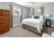 Comfortable bedroom features plush carpet, neutral decor, and natural light from two windows at 760 Deframe St, Golden, CO 80401