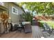 Wooden deck has outdoor seating, views of the backyard, and provides ample space for relaxing and entertaining at 760 Deframe St, Golden, CO 80401