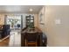 Dining area featuring a dark wood table with chairs and bench seating next to sliding glass doors at 760 Deframe St, Golden, CO 80401