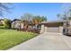 Well-maintained home exterior with a manicured lawn, mature landscaping, and an inviting front entrance at 760 Deframe St, Golden, CO 80401