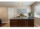 Kitchen island with stone countertops, drawers and cabinets at 760 Deframe St, Golden, CO 80401