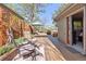 Spacious backyard patio featuring lounge chairs, umbrella, and decorative accents at 760 Deframe St, Golden, CO 80401