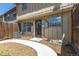 Fenced backyard featuring wood trim and mulched ground at 8780 E Yale Ave, Denver, CO 80231