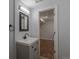 Bathroom view into bedroom, showcasing modern fixtures and finishes, with seamless design and natural light at 8780 E Yale Ave, Denver, CO 80231