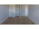 Bedroom featuring neutral carpet and closet at 8780 E Yale Ave, Denver, CO 80231