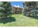 Inviting townhome with well-maintained lawn and balcony perfect for relaxing in a serene setting at 8780 E Yale Ave, Denver, CO 80231