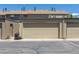 View of the tan detached garage in front of the condo unit at 8780 E Yale Ave, Denver, CO 80231