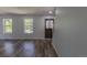 Bright living room featuring wood floors, natural light, and a freshly painted interior for a welcoming atmosphere at 8780 E Yale Ave, Denver, CO 80231