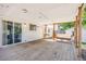Spacious back porch with a swing and sliding glass doors to the house at 359 S 25Th Ave, Brighton, CO 80601