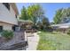 View of home backyard with a covered back porch at 359 S 25Th Ave, Brighton, CO 80601