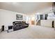 Spacious basement with plush carpeting, neutral walls, a wet bar, and a comfortable seating area at 359 S 25Th Ave, Brighton, CO 80601