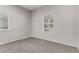 Neutral bedroom with carpet flooring and ample natural light from two windows at 725 Knox Ct, Denver, CO 80204