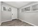Bright bonus room with modern flooring and several windows offering natural light at 725 Knox Ct, Denver, CO 80204