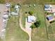 Bird's eye view of a house with an extra large lot, long driveway and many outbuildings at 5602 County Road 15, Fort Lupton, CO 80621