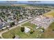 Aerial view showing a quiet neighborhood and nearby amenities such as Centennial Park at 5602 County Road 15, Fort Lupton, CO 80621