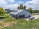 Aerial view of the home and property, complete with the covered patio, and expansive lot at 5602 County Road 15, Fort Lupton, CO 80621