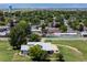 Aerial view of a well-kept house situated on a large lot with mature trees at 5602 County Road 15, Fort Lupton, CO 80621