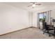 Bedroom with carpet flooring, natural lighting, and a desk setup, perfect for an office or study space at 5602 County Road 15, Fort Lupton, CO 80621