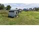 View of outbuildings and green space on this rural property with several storage options at 5602 County Road 15, Fort Lupton, CO 80621