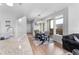 Open dining area with modern lighting and sliding glass doors at 5110 E 64Th Ave, Commerce City, CO 80022