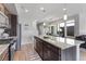 Kitchen island with granite countertops and seating at 5110 E 64Th Ave, Commerce City, CO 80022