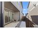 View of a covered patio area with outdoor table and chairs, and access to backyard area at 5110 E 64 Ave, Commerce City, CO 80022