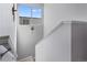 Staircase featuring gray walls, white trim, and a window to let light in at 5110 E 64Th Ave, Commerce City, CO 80022