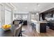 Open floor plan showcases a spacious living room connected to the modern kitchen at 5110 E 64Th Ave, Commerce City, CO 80022