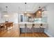 Open kitchen with island and bar stools at 4911 Lowell Blvd # 102, Denver, CO 80221