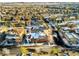 Aerial view of a townhouse with snow covered roofs in a neighborhood at 3851 Stonebrush Dr # 11B, Littleton, CO 80126