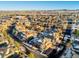 Aerial view of a residential neighborhood with a townhouse and mountain view at 3851 Stonebrush Dr # 11B, Littleton, CO 80126