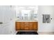 Double vanity bathroom with a large mirror and plenty of counter space at 3851 Stonebrush Dr # 11B, Littleton, CO 80126