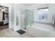 Bathroom with a large soaking tub, shower, and updated fixtures at 3851 Stonebrush Dr # 11B, Littleton, CO 80126