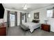 Bright bedroom featuring a comfortable bed and plenty of natural light at 3851 Stonebrush Dr # 11B, Littleton, CO 80126