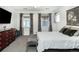 Main bedroom with a large bed, dresser and neutral decor at 3851 Stonebrush Dr # 11B, Littleton, CO 80126